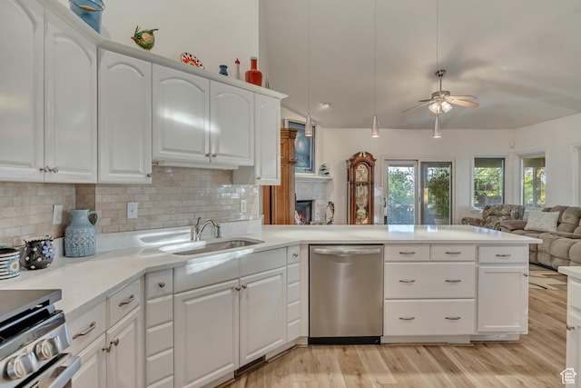 3286 N Piute Dr, Provo, UT 84604 - kitchen with appliances with stainless steel finishes, a sink, open floor plan, ceiling fan, and a peninsula