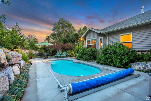 3286 N Piute Dr, Provo, UT 84604 - pool at dusk with a patio area and a covered pool