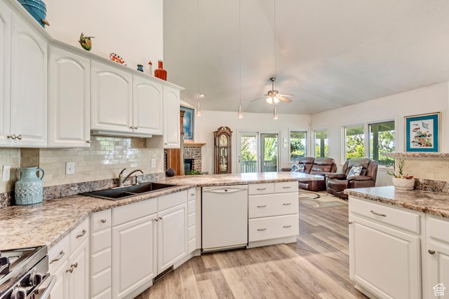 3286 N Piute Dr, Provo, UT 84604 - kitchen featuring white dishwasher, a sink, ceiling fan, light wood-style flooring, and tasteful backsplash