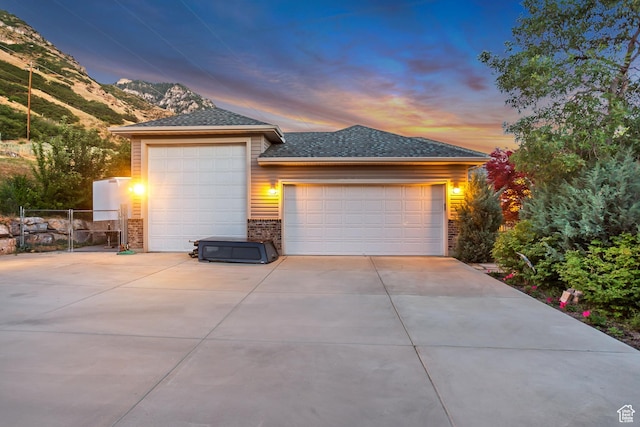 3286 N Piute Dr, Provo, UT 84604 - view of front of home featuring brick siding, a gate, and a shingled roof