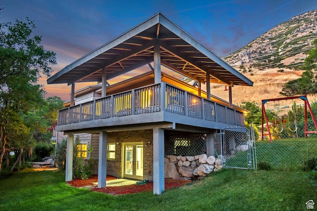 3286 N Piute Dr, Provo, UT 84604 - rear view of house featuring a deck, a gate, and brick siding