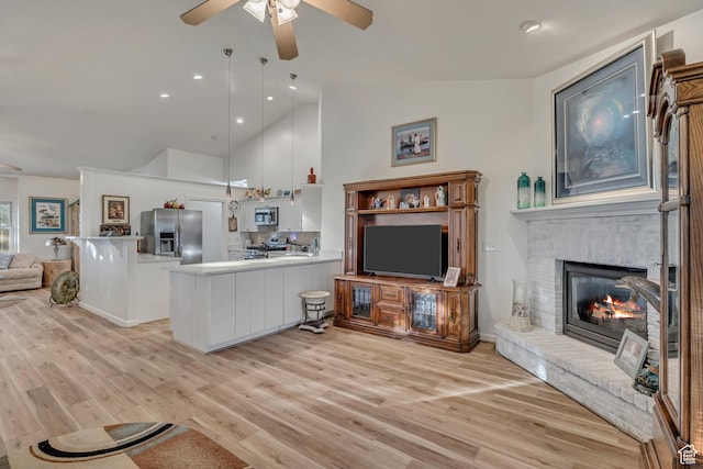 3286 N Piute Dr, Provo, UT 84604 - living room with ceiling fan, light wood-style floors, high vaulted ceiling, a brick fireplace, and recessed lighting