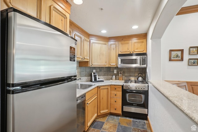 840 Bigler Ln Unit 2021, Midway, UT 84049 - kitchen with stainless steel appliances, stone finish floors, light countertops, decorative backsplash, and a sink
