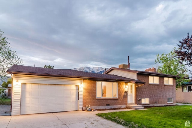 171 E 200 N, Orem, UT 84057 - tri-level home featuring brick siding, driveway, an attached garage, and a chimney