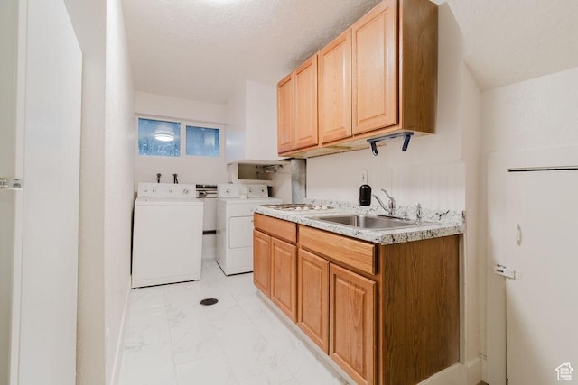 171 E 200 N, Orem, UT 84057 - washroom featuring washing machine and dryer, light marble finish floors, cabinet space, and a textured ceiling