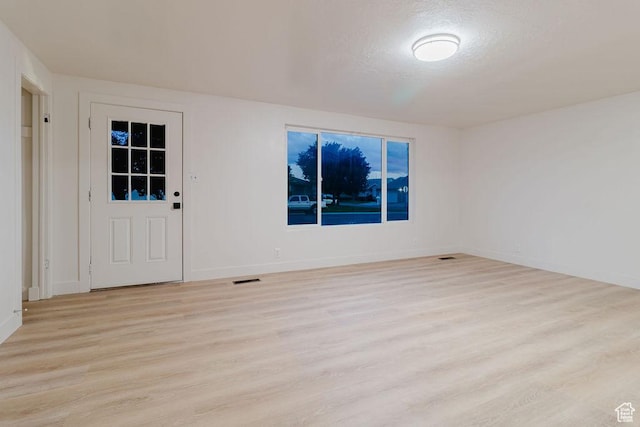 171 E 200 N, Orem, UT 84057 - spare room with light wood-style floors, baseboards, and a textured ceiling