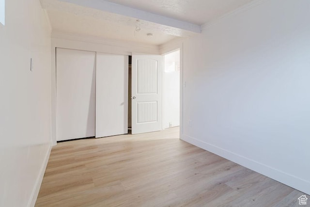 171 E 200 N, Orem, UT 84057 - unfurnished bedroom featuring wood finished floors, baseboards, a closet, and crown molding
