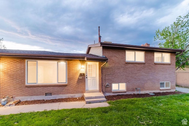171 E 200 N, Orem, UT 84057 - split level home featuring brick siding, a front lawn, and a chimney