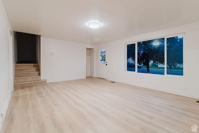 171 E 200 N, Orem, UT 84057 - empty room with wood finished floors, stairway, and baseboards