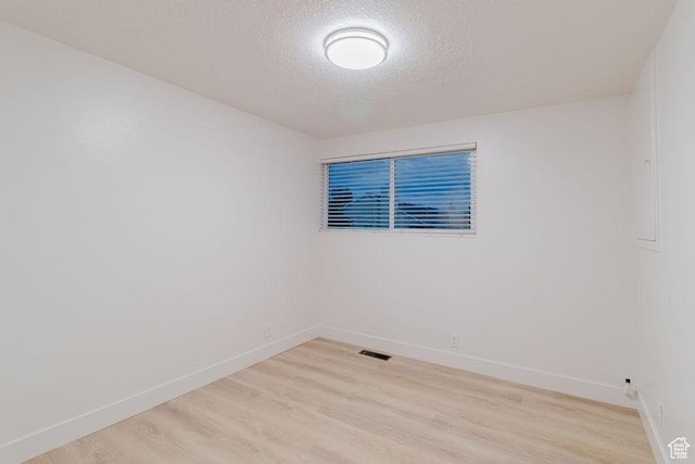 171 E 200 N, Orem, UT 84057 - empty room with baseboards, a textured ceiling, and light wood finished floors
