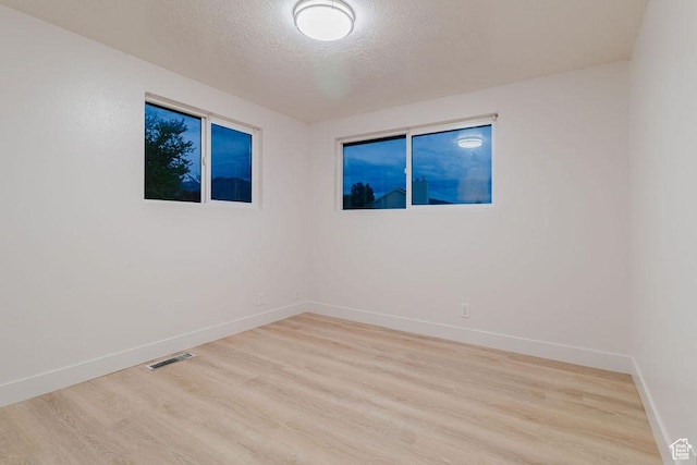 171 E 200 N, Orem, UT 84057 - spare room with light wood-style flooring, a textured ceiling, and baseboards