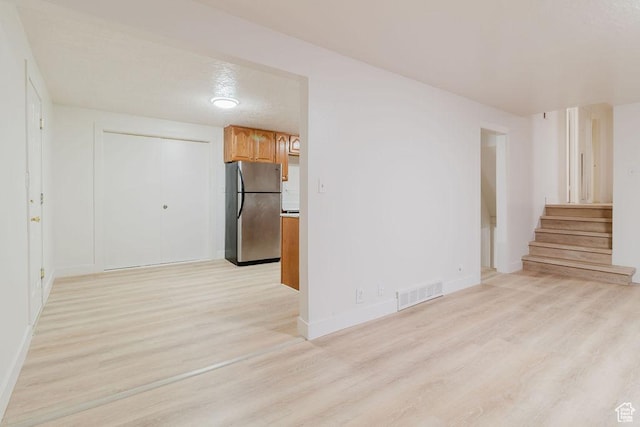 171 E 200 N, Orem, UT 84057 - unfurnished room with light wood-style flooring, stairway, and baseboards