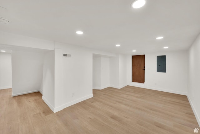 532 E 600 S, Salt Lake City, UT 84102 - unfurnished room featuring electric panel, recessed lighting, light wood-style flooring, and baseboards