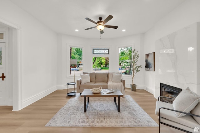 532 E 600 S, Salt Lake City, UT 84102 - living area featuring a high end fireplace, a ceiling fan, light wood finished floors, baseboards, and recessed lighting