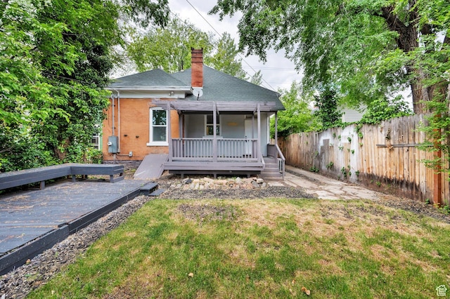 532 E 600 S, Salt Lake City, UT 84102 - back of property with a deck, a chimney, brick siding, and a shingled roof