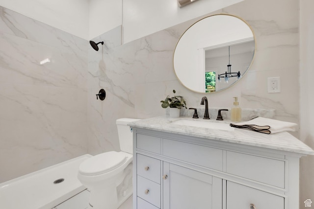 532 E 600 S, Salt Lake City, UT 84102 - bathroom featuring vanity, a marble finish shower, toilet, tile walls, and a chandelier