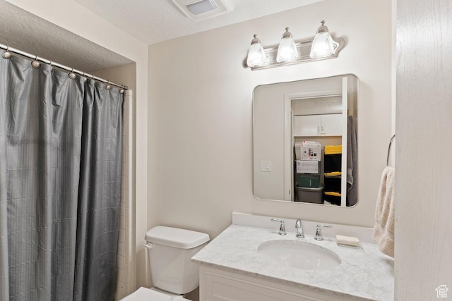 1162 S 885 E, Ogden, UT 84404 - full bathroom featuring vanity, toilet, a textured ceiling, and a shower with shower curtain