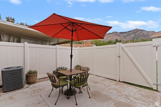 1162 S 885 E, Ogden, UT 84404 - fenced backyard with a mountain view, a gate, central AC unit, and a patio