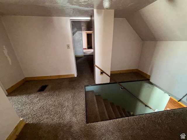 149 Thomas Fork Ln, Geneva, ID 83238 - stairway featuring carpet floors, lofted ceiling, and baseboards