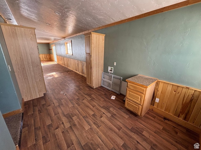 149 Thomas Fork Ln, Geneva, ID 83238 - empty room with dark wood-style floors, wooden walls, and wainscoting