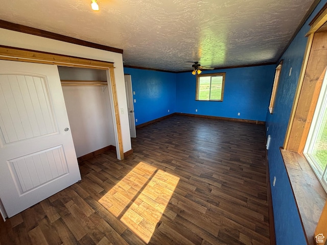 149 Thomas Fork Ln, Geneva, ID 83238 - unfurnished bedroom featuring dark wood-style floors, a textured ceiling, baseboards, and a closet