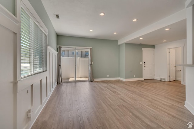 4917 W Stormy Meadow Dr, Riverton, UT 84096 - unfurnished living room featuring recessed lighting, light wood-type flooring, and baseboards