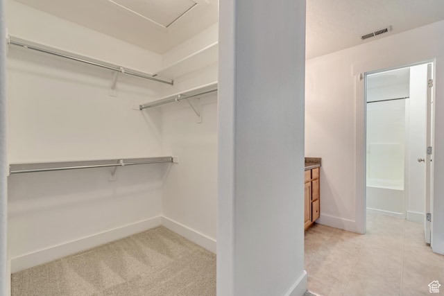 4917 W Stormy Meadow Dr, Riverton, UT 84096 - spacious closet featuring light tile patterned flooring