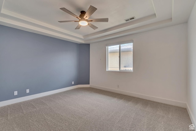4917 W Stormy Meadow Dr, Riverton, UT 84096 - unfurnished room featuring a tray ceiling, a ceiling fan, carpet, and baseboards