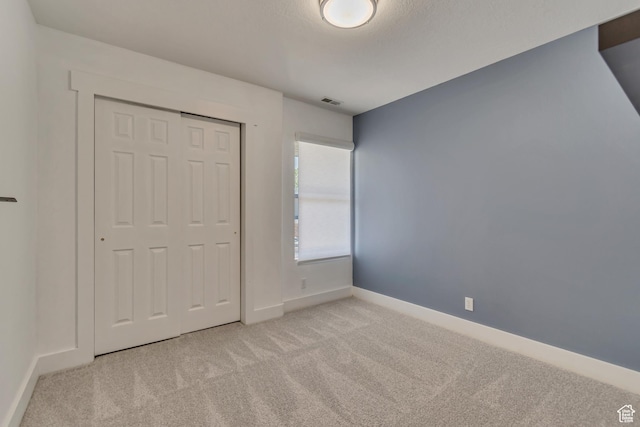 4917 W Stormy Meadow Dr, Riverton, UT 84096 - unfurnished bedroom with carpet floors, baseboards, and a closet