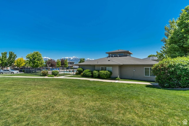 4917 W Stormy Meadow Dr, Riverton, UT 84096 - view of front of home with a mountain view and stucco siding