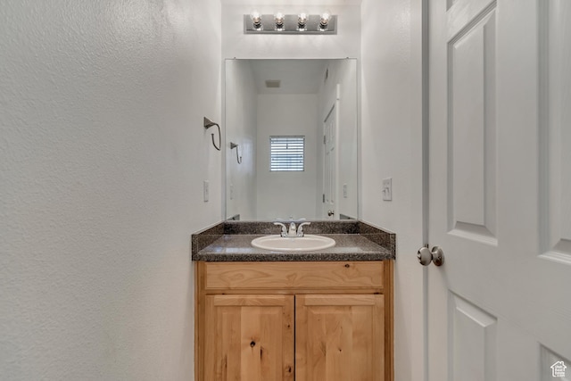 4917 W Stormy Meadow Dr, Riverton, UT 84096 - bathroom featuring vanity and a textured wall