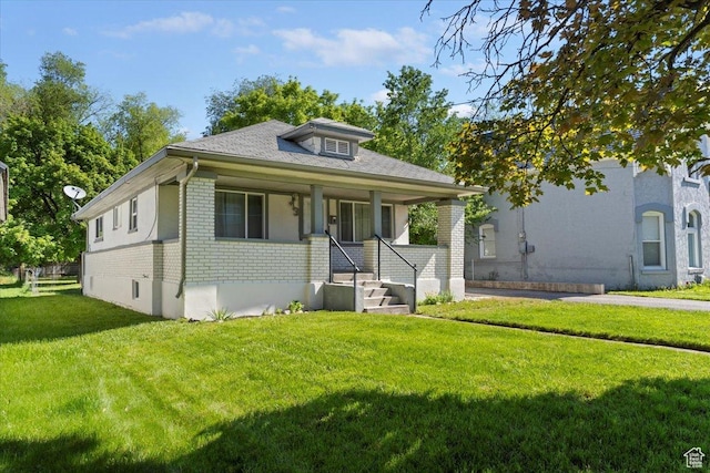 73 E 400 S, Logan, UT 84321 - bungalow with a front lawn, a porch, and brick siding