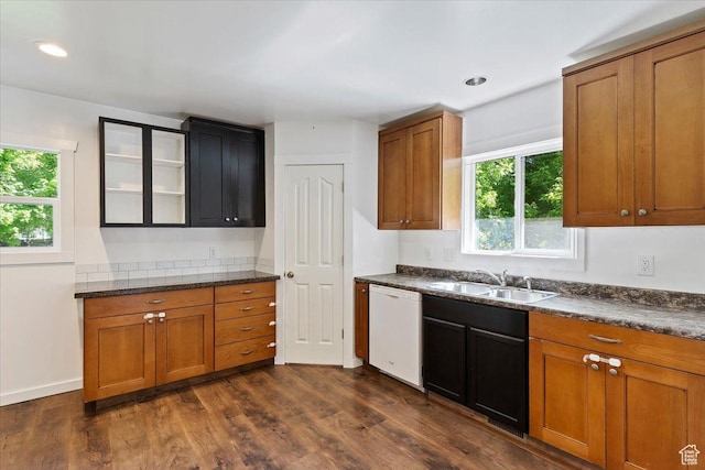 73 E 400 S, Logan, UT 84321 - kitchen featuring white dishwasher, a sink, healthy amount of natural light, brown cabinetry, and recessed lighting