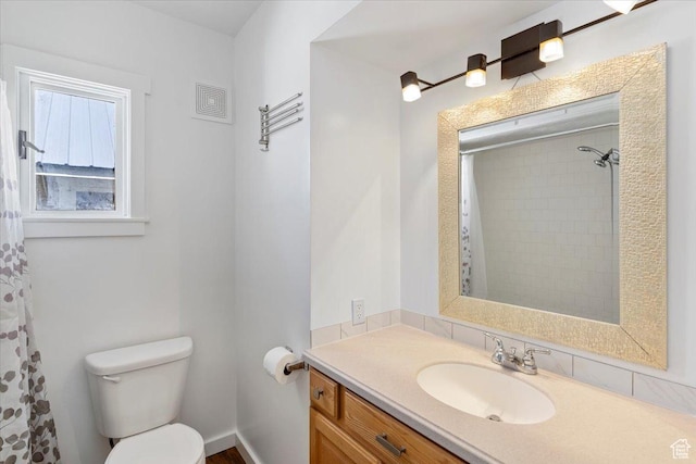 73 E 400 S, Logan, UT 84321 - full bath featuring toilet, vanity, and a shower with shower curtain