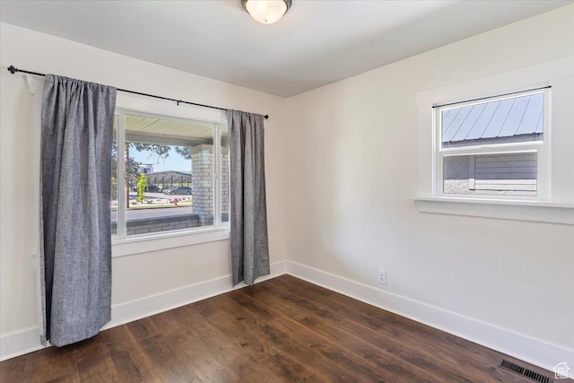 73 E 400 S, Logan, UT 84321 - empty room featuring baseboards and dark wood-type flooring