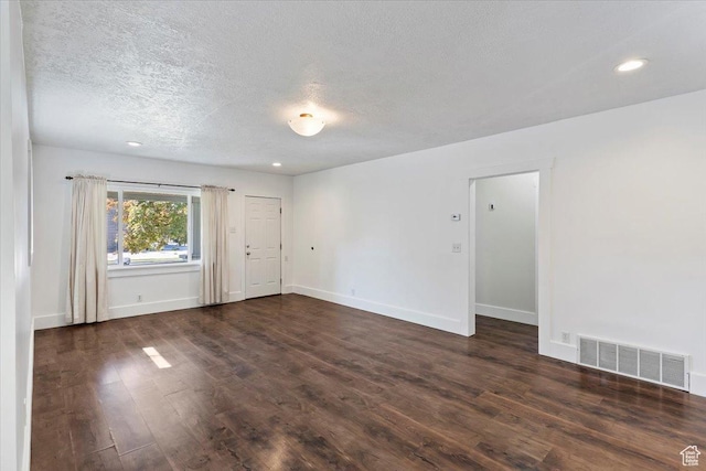 73 E 400 S, Logan, UT 84321 - unfurnished room with a textured ceiling, dark wood-type flooring, baseboards, and recessed lighting
