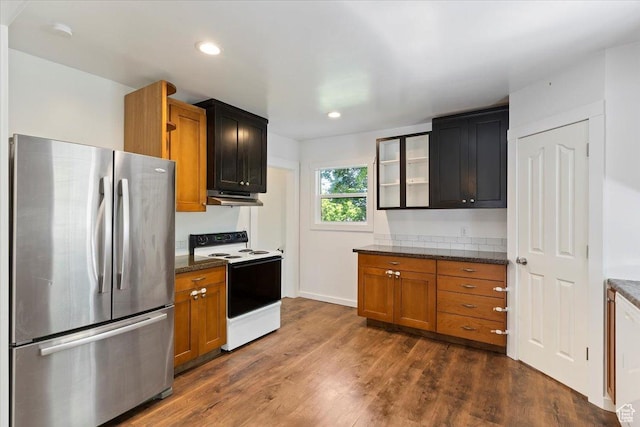 73 E 400 S, Logan, UT 84321 - kitchen featuring freestanding refrigerator, electric range, dark wood-type flooring, recessed lighting, and dark stone counters