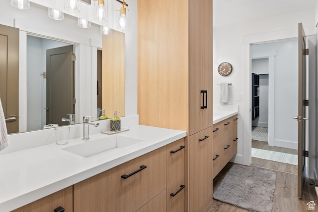 2508 E 70 S Unit 4, Heber City, UT 84032 - bathroom featuring vanity, wood finished floors, and baseboards