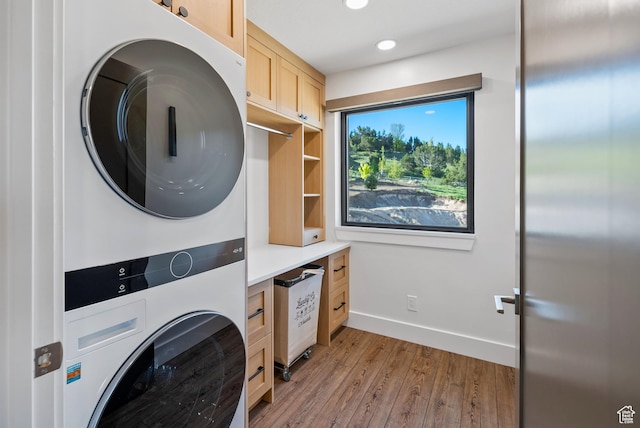 2508 E 70 S Unit 4, Heber City, UT 84032 - washroom with stacked washer / drying machine, cabinet space, light wood finished floors, recessed lighting, and baseboards