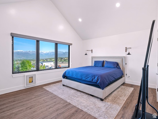 2508 E 70 S Unit 4, Heber City, UT 84032 - bedroom with a mountain view, wood finished floors, recessed lighting, baseboards, and high vaulted ceiling