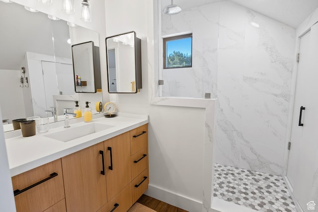 2508 E 70 S Unit 4, Heber City, UT 84032 - bathroom featuring a marble finish shower, vanity, wood finished floors, and baseboards