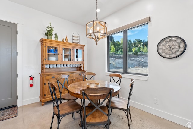 2508 E 70 S Unit 4, Heber City, UT 84032 - dining space with baseboards, finished concrete flooring, and a chandelier