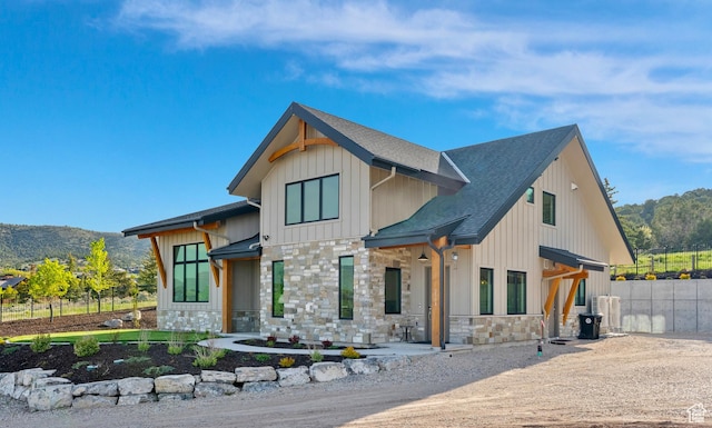 2508 E 70 S Unit 4, Heber City, UT 84032 - modern farmhouse style home with stone siding, board and batten siding, a shingled roof, and a mountain view