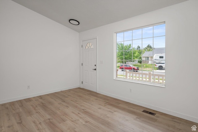 5094 W Pebblerock Cir S, West Jordan, UT 84081 - empty room with wood finished floors, vaulted ceiling, and baseboards