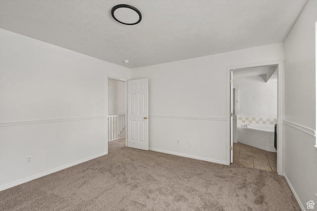 5094 W Pebblerock Cir S, West Jordan, UT 84081 - unfurnished bedroom featuring carpet floors, baseboards, and ensuite bathroom