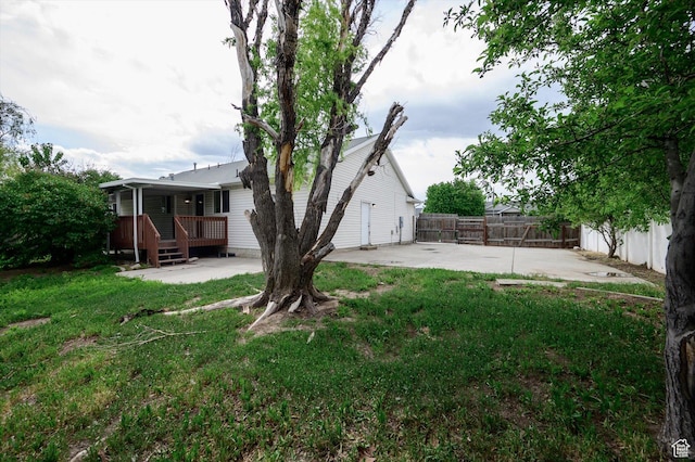 5094 W Pebblerock Cir S, West Jordan, UT 84081 - view of yard featuring a patio area and a deck