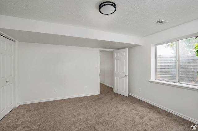 5094 W Pebblerock Cir S, West Jordan, UT 84081 - unfurnished bedroom with carpet, a textured ceiling, baseboards, and a closet