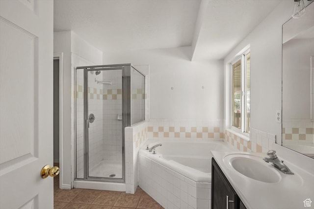 5094 W Pebblerock Cir S, West Jordan, UT 84081 - full bath featuring a bath, a shower stall, vanity, and tile patterned floors