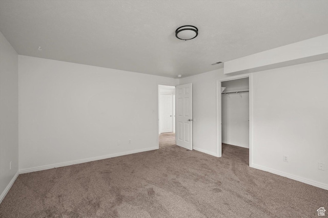 5094 W Pebblerock Cir S, West Jordan, UT 84081 - unfurnished bedroom featuring carpet flooring, baseboards, a closet, and a walk in closet