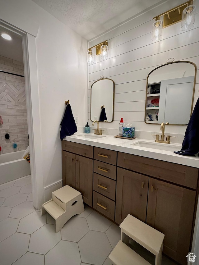 268 N 1400 W, Midway, UT 84049 - bathroom featuring double vanity, tile patterned floors, a textured ceiling, and washtub / shower combination